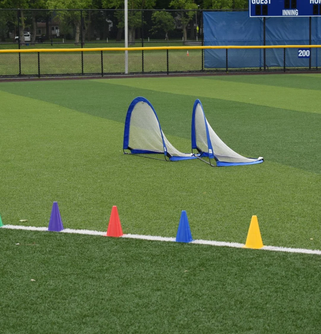 Training cones and portable goals on an institutional sports field