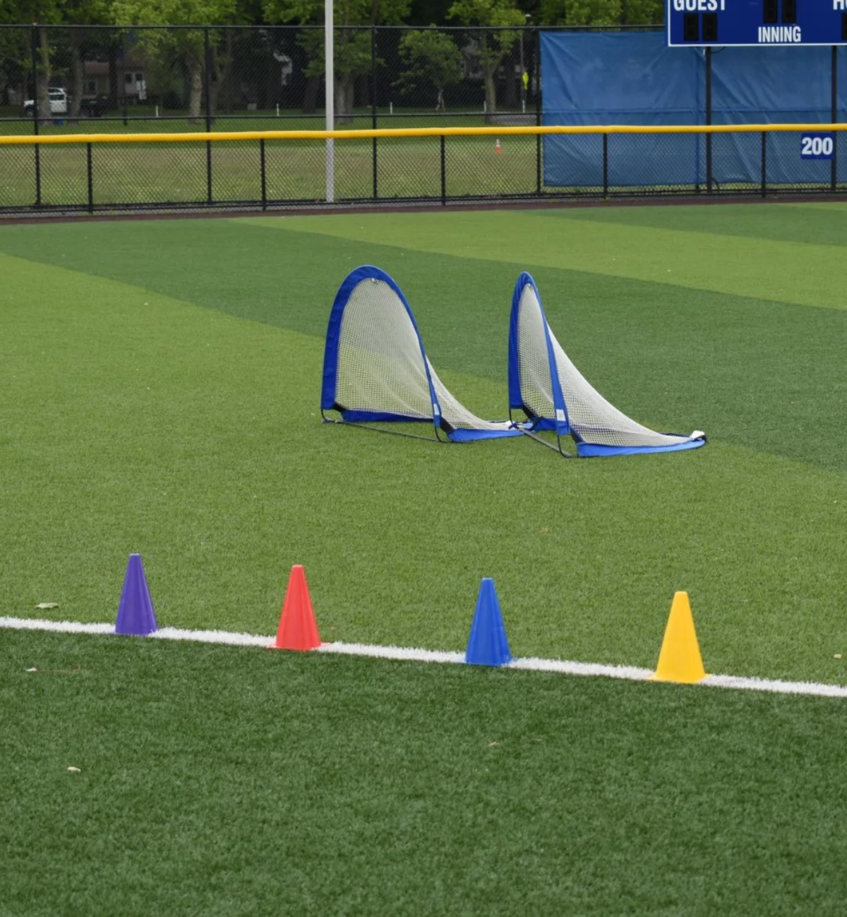 Training cones and portable goals on an institutional sports field